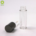 empty round plastic clear lipstick container with black cap